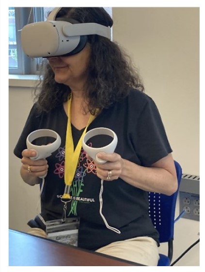 UNH Tech Camp Director, Dr. Amato-Wierda, interacting with a DNA model using the Oculus VR headset