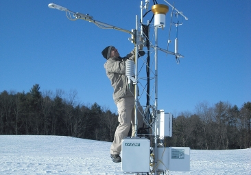 researcher working outdoors in the snow